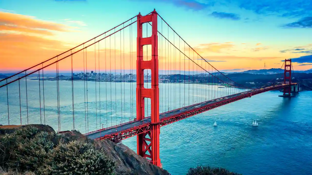 The Golden Gate Bridge, an iconic symbol of San Francisco and an engineering marvel spans majestically across the Golden Gate Strait. With its towering orange towers and sweeping vistas of the bay, it offers an unforgettable experience and serves as a gateway to the vibrant city beyond.